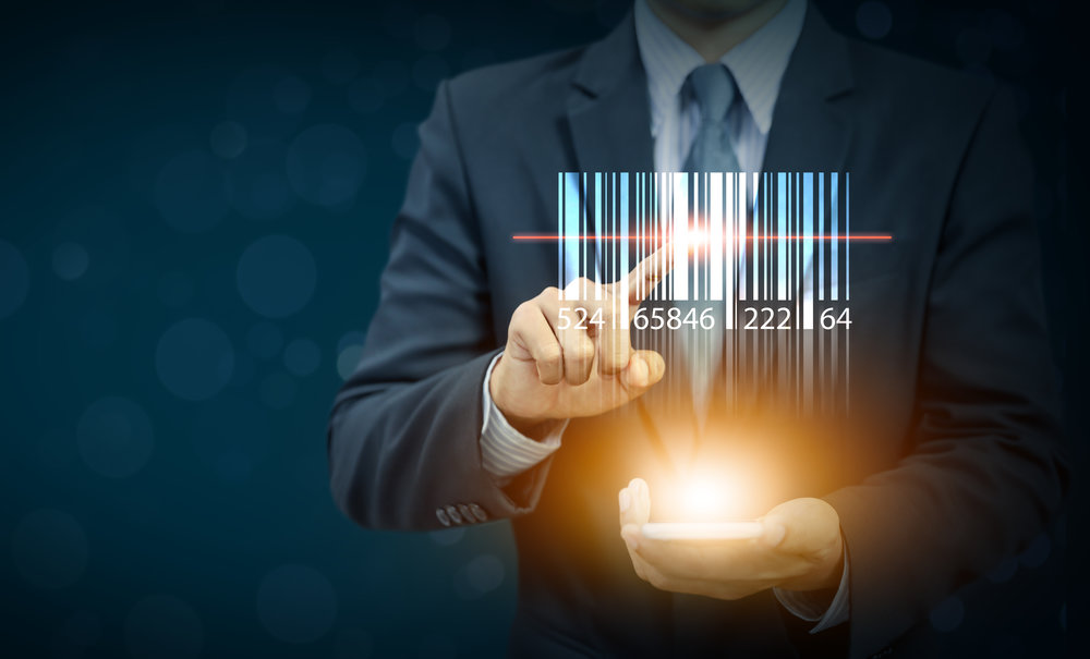 Businessman show barcode with glow light on hand, warehouse and logistics