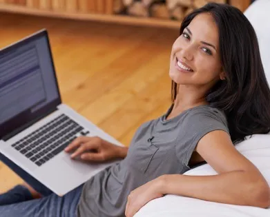 Shot of a young woman using a laptop while relaxing at homehttp://195.154.178.81/DATA/i_collage/pi/shoots/783522.jpg