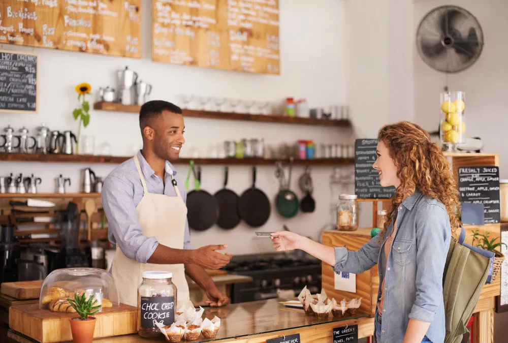 Cropped shot of an attractive young woman placing an order at a coffee shop