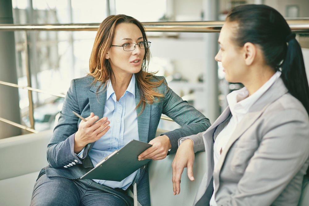 Hr manager asking questions to female candidate