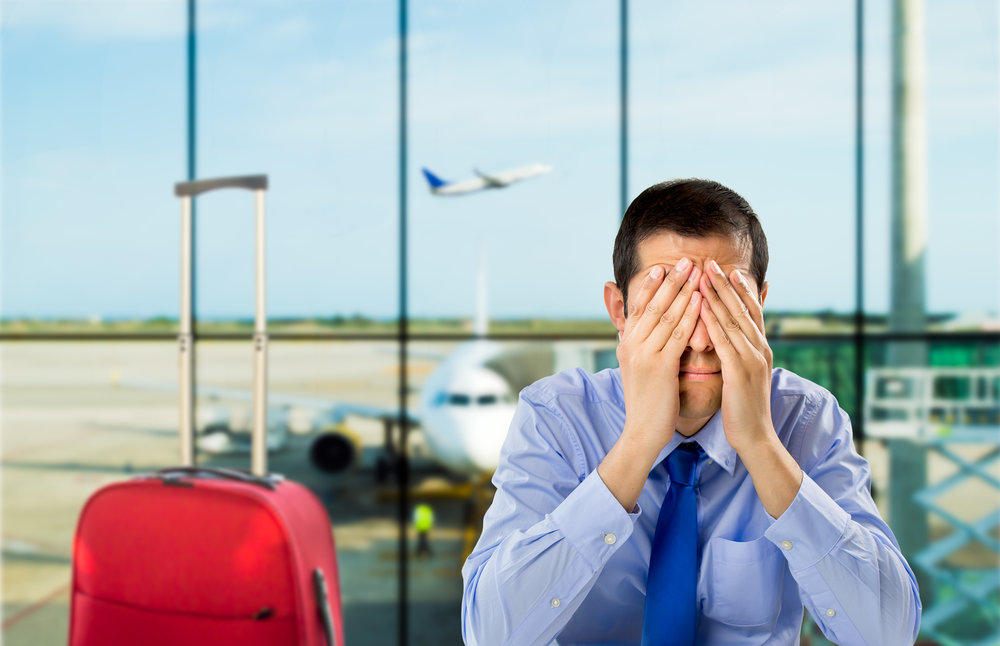 crying businessman who delayed flight at an airport