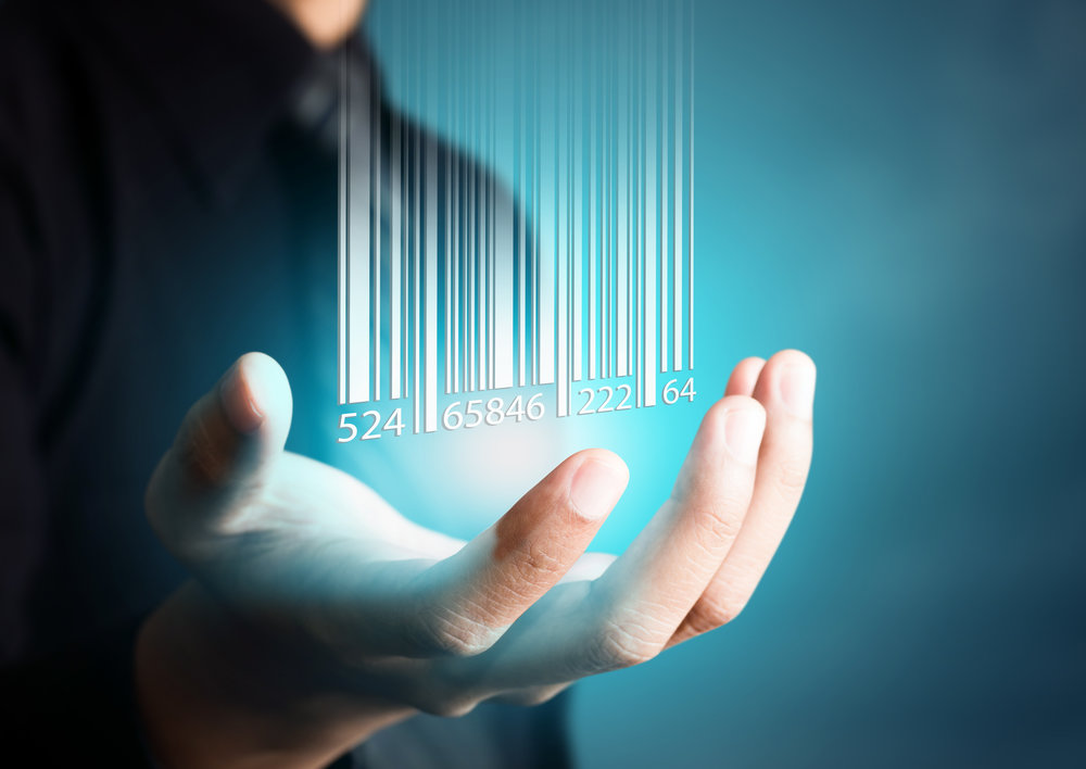 Barcode dropping on businessman hand, financial concept